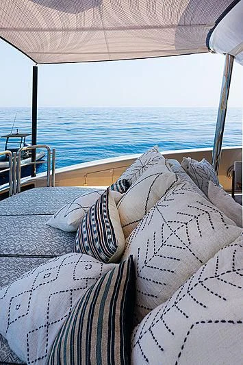 a bed with pillows on it aboard A2 Yacht for Sale