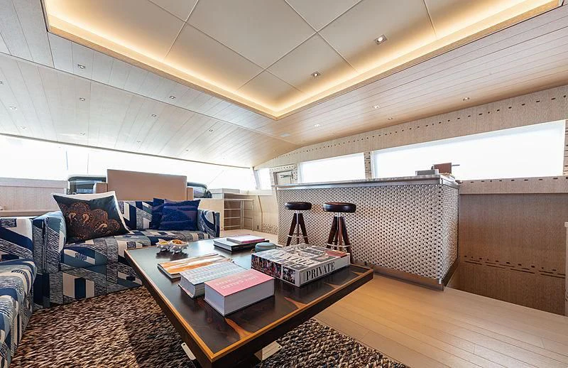 a living room with a couch and a coffee table aboard A2 Yacht for Sale