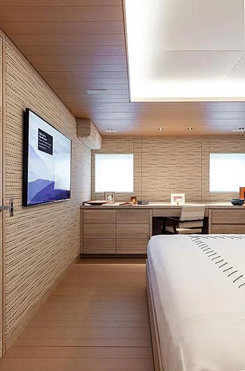 a room with a desk and a bed aboard A2 Yacht for Sale