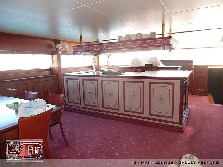 a kitchen with a table and chairs aboard A2 Yacht for Sale