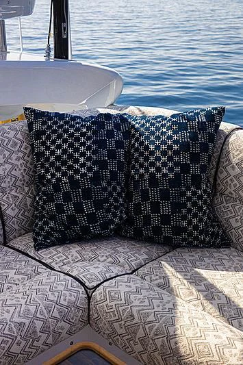 a group of pillows on a table aboard A2 Yacht for Sale