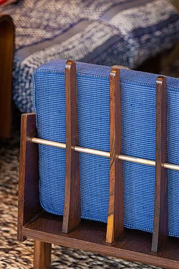 a wooden chair with a blue cover aboard A2 Yacht for Sale