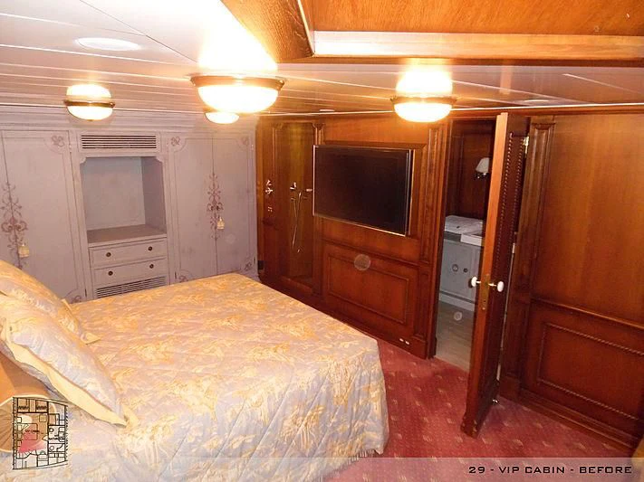 a bedroom with a bed and a television aboard A2 Yacht for Sale