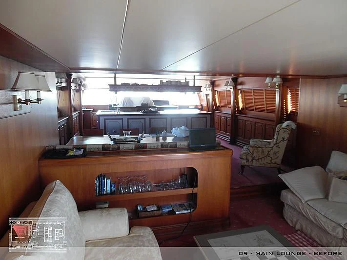 a living room with a wood coffee table and a couch aboard A2 Yacht for Sale