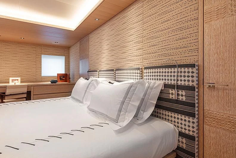 a room with a bed and a desk aboard A2 Yacht for Sale