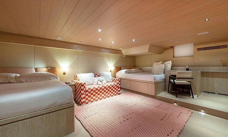 a room with beds and a couch aboard A2 Yacht for Sale