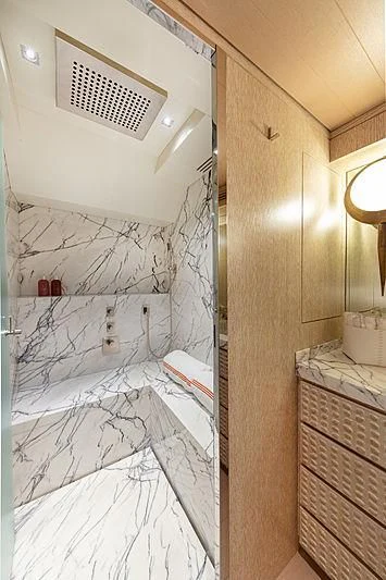 a bathroom with a shower curtain aboard A2 Yacht for Sale