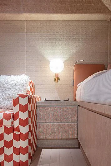 a room with a bed and a lamp aboard A2 Yacht for Sale