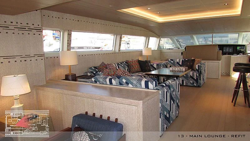 a living room with a couch and a table aboard A2 Yacht for Sale