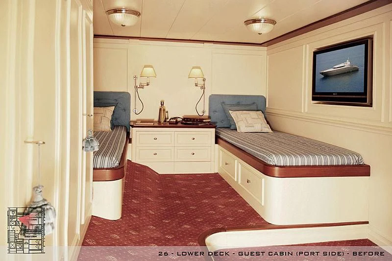 a bedroom with a bed and a desk aboard A2 Yacht for Sale