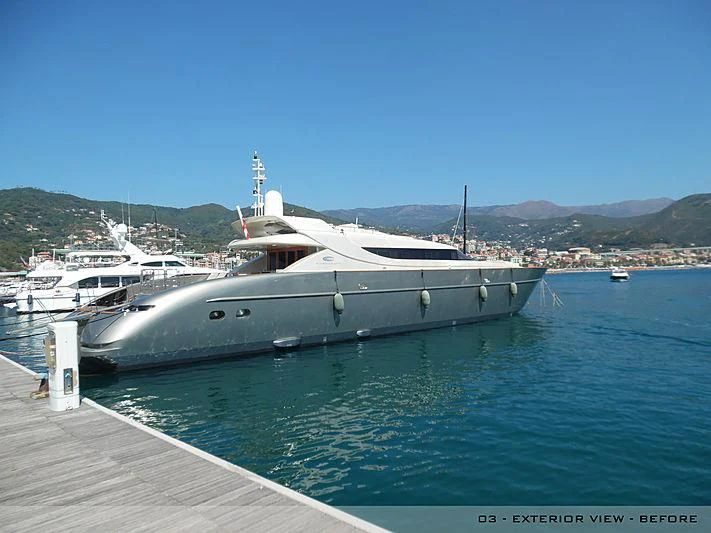 a large white boat docked at a pier aboard A2 Yacht for Sale