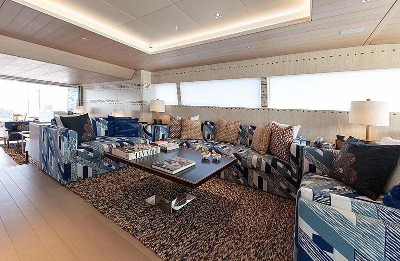 a living room with a large rug aboard A2 Yacht for Sale