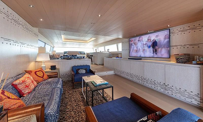 a living room with a large screen aboard A2 Yacht for Sale