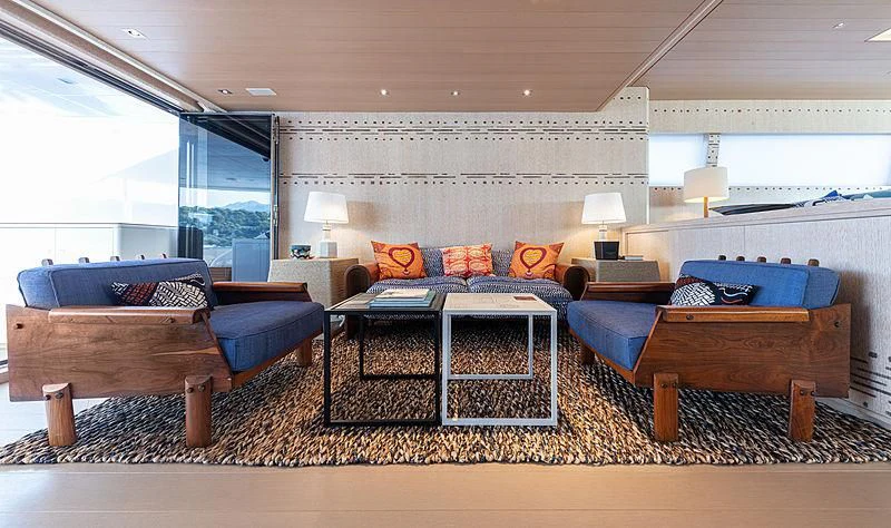 a large bedroom with a bed and a couch aboard A2 Yacht for Sale