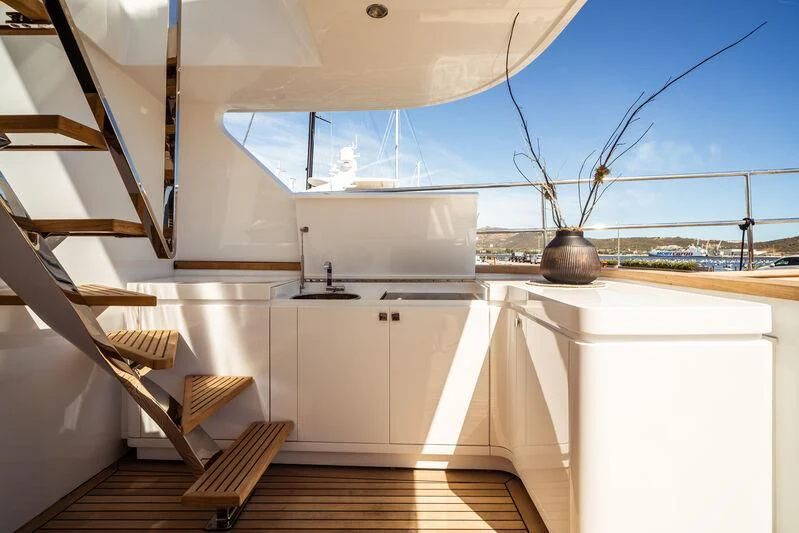 a kitchen with a large window aboard ONE FORCE Yacht for Sale