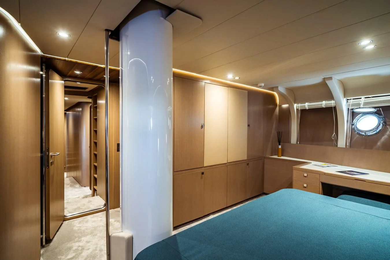 a room with a blue bed sheet aboard ONE FORCE Yacht for Sale