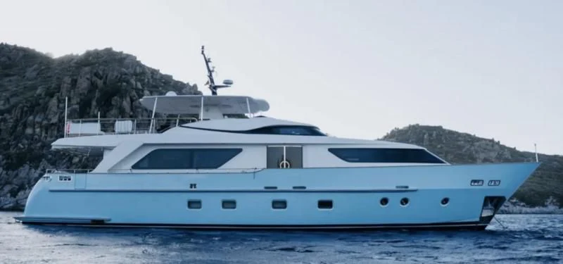 a white yacht in the water aboard MAI Yacht for Sale