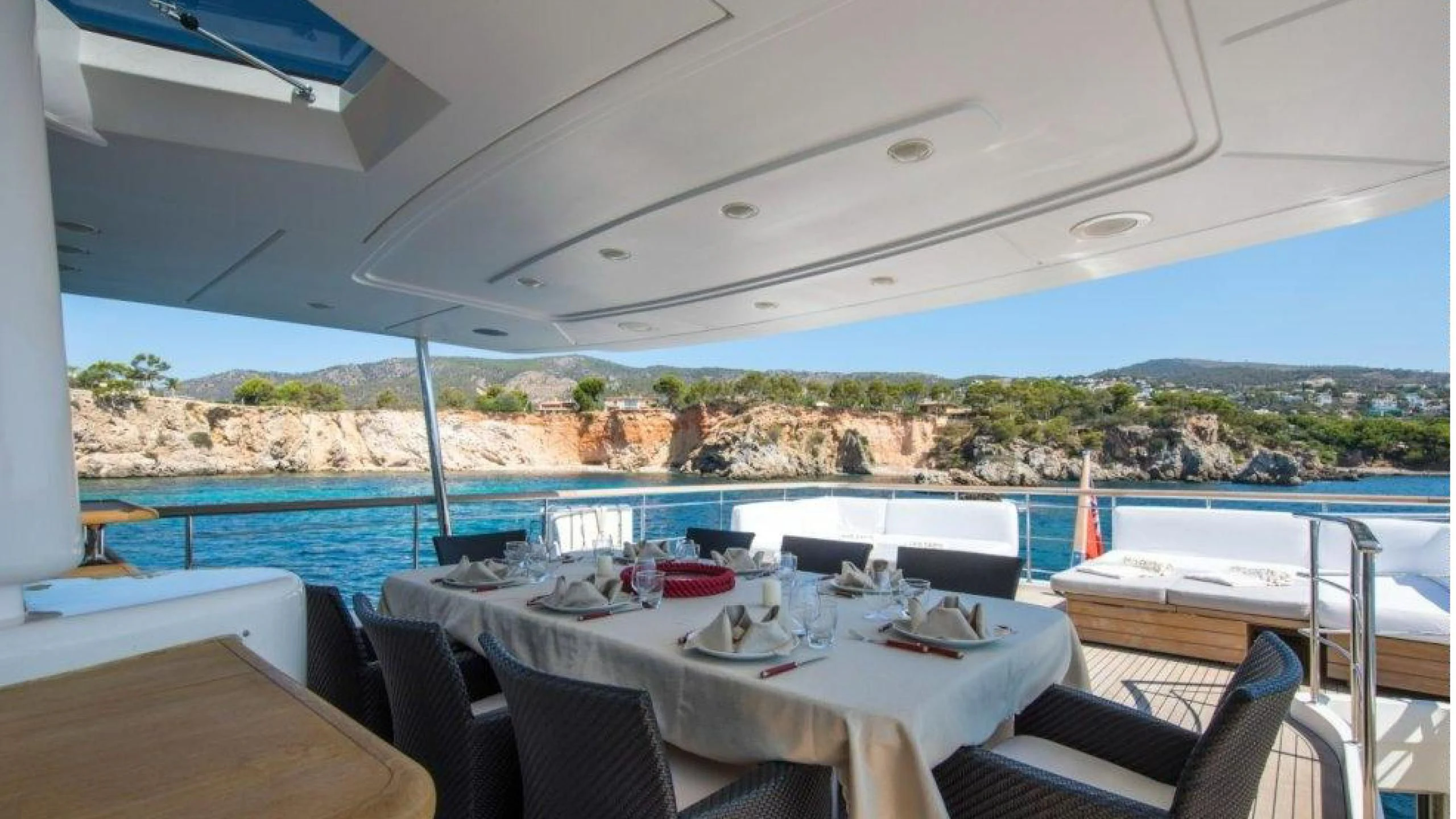 a table set for a meal on a boat aboard MAI Yacht for Sale