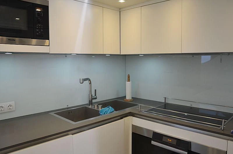 a kitchen with a sink and a stove aboard MAI Yacht for Sale