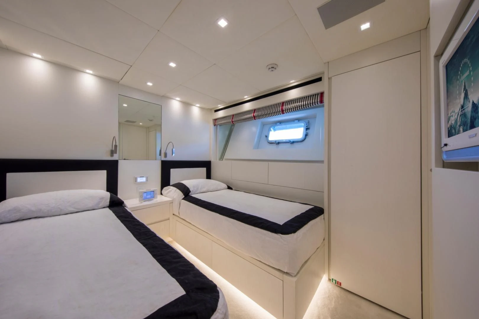a room with two beds aboard MAI Yacht for Sale