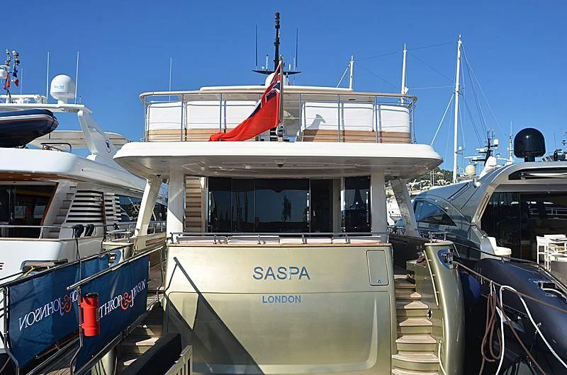 a boat docked at a pier aboard MAI Yacht for Sale