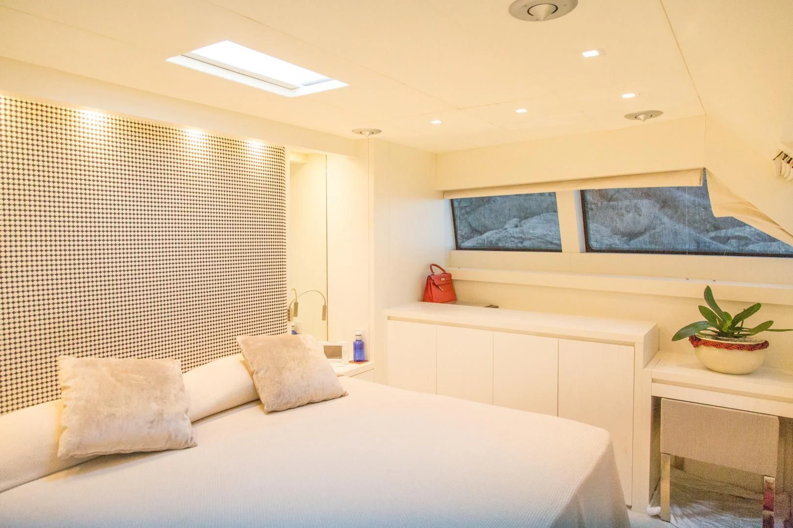 a room with a bed and a desk aboard MAI Yacht for Sale