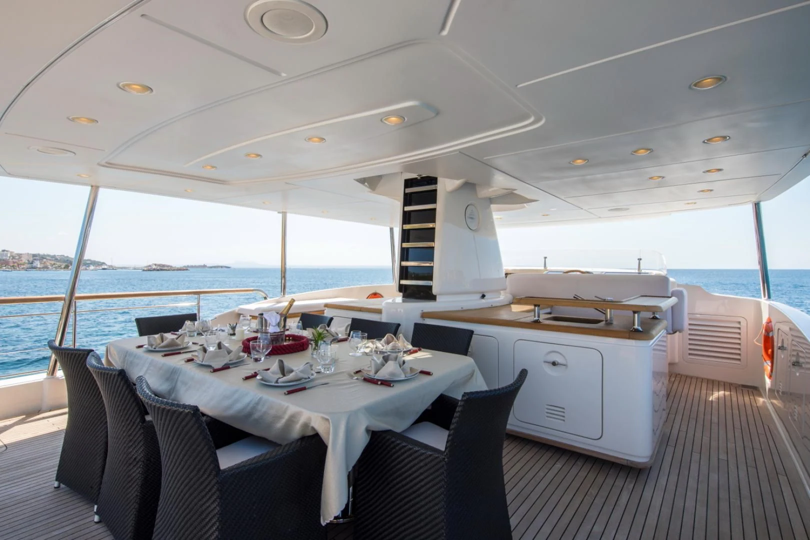 a boat with a table and chairs aboard MAI Yacht for Sale