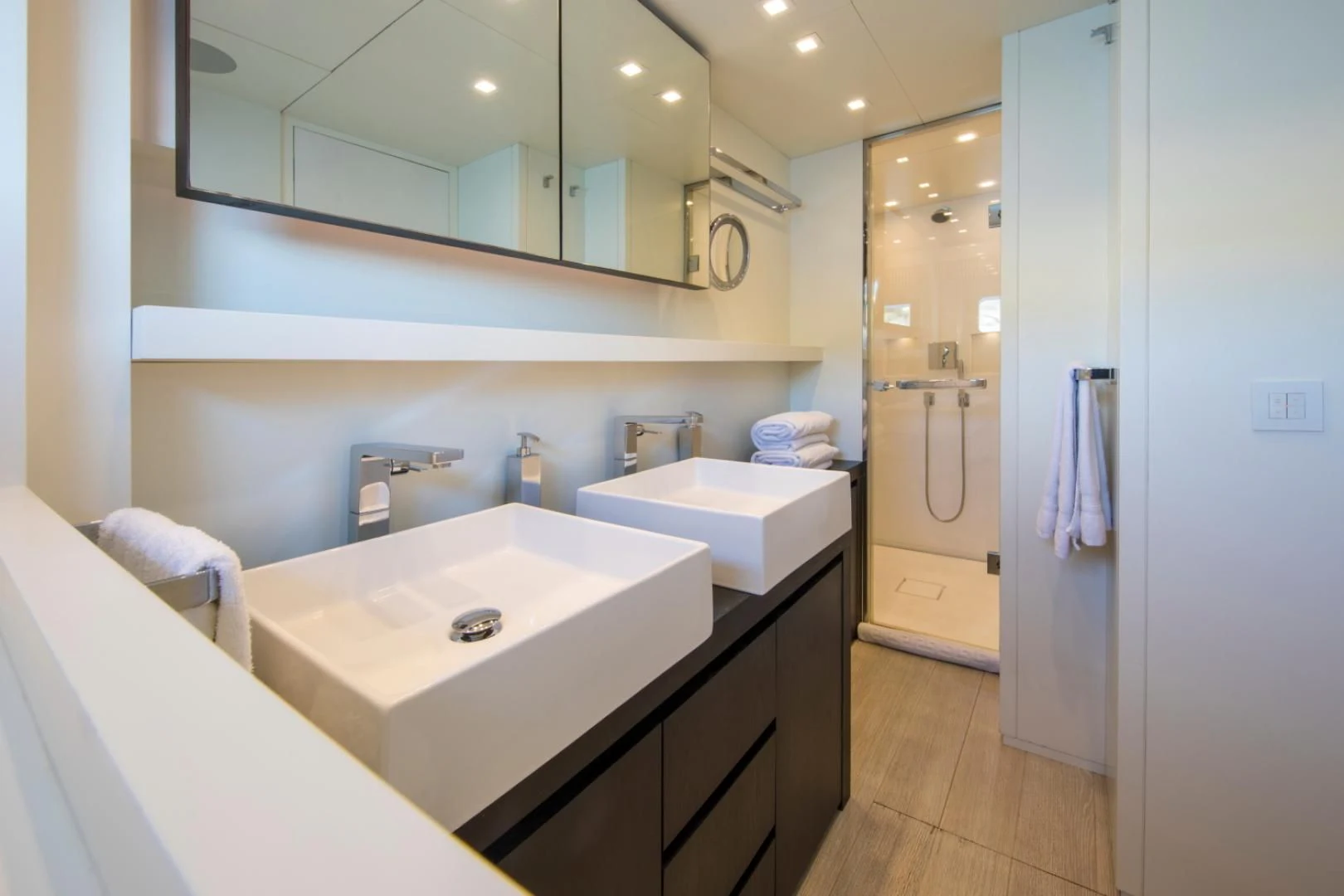 a bathroom with a large mirror aboard MAI Yacht for Sale