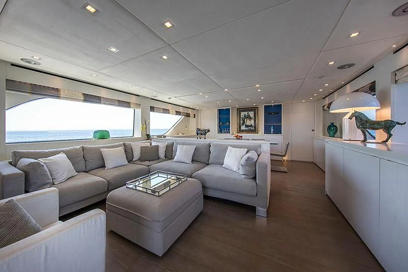 a living room with a couch and a tv aboard MAI Yacht for Sale