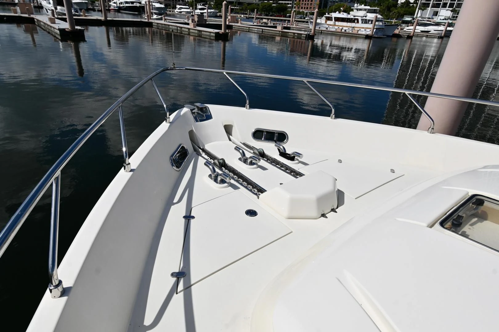 a white boat on a body of water aboard RABBIT Yacht for Sale
