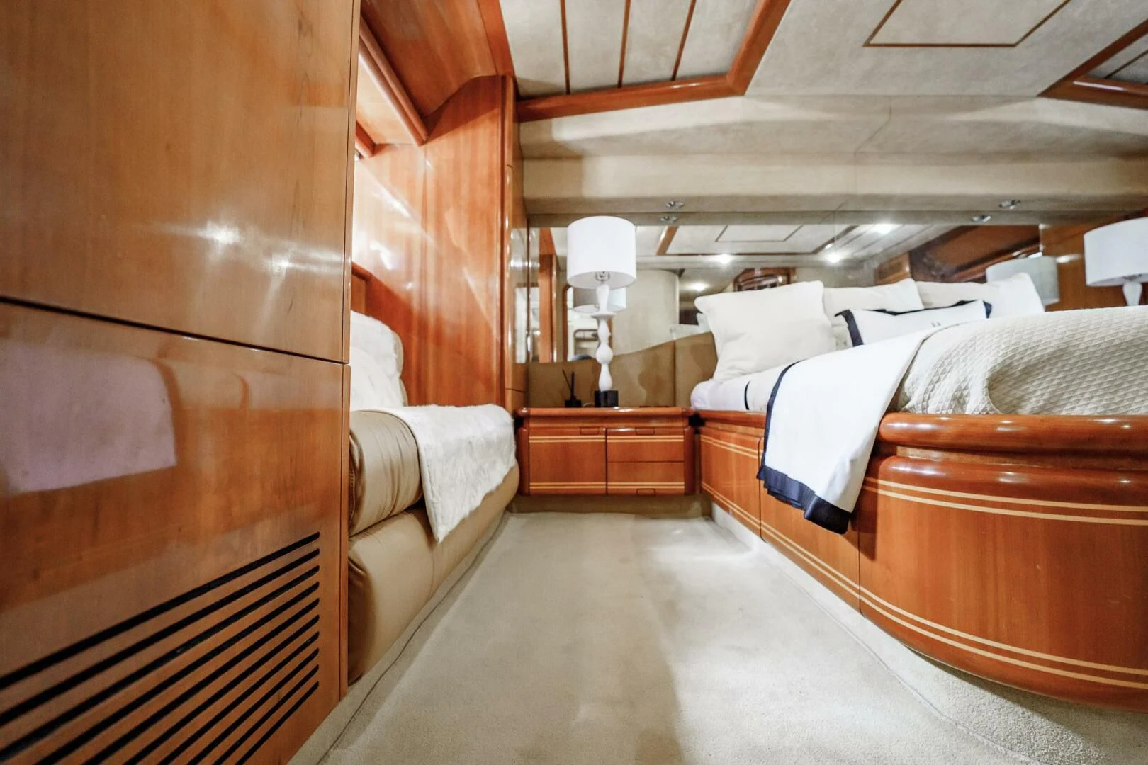a room with wooden furniture aboard RABBIT Yacht for Sale