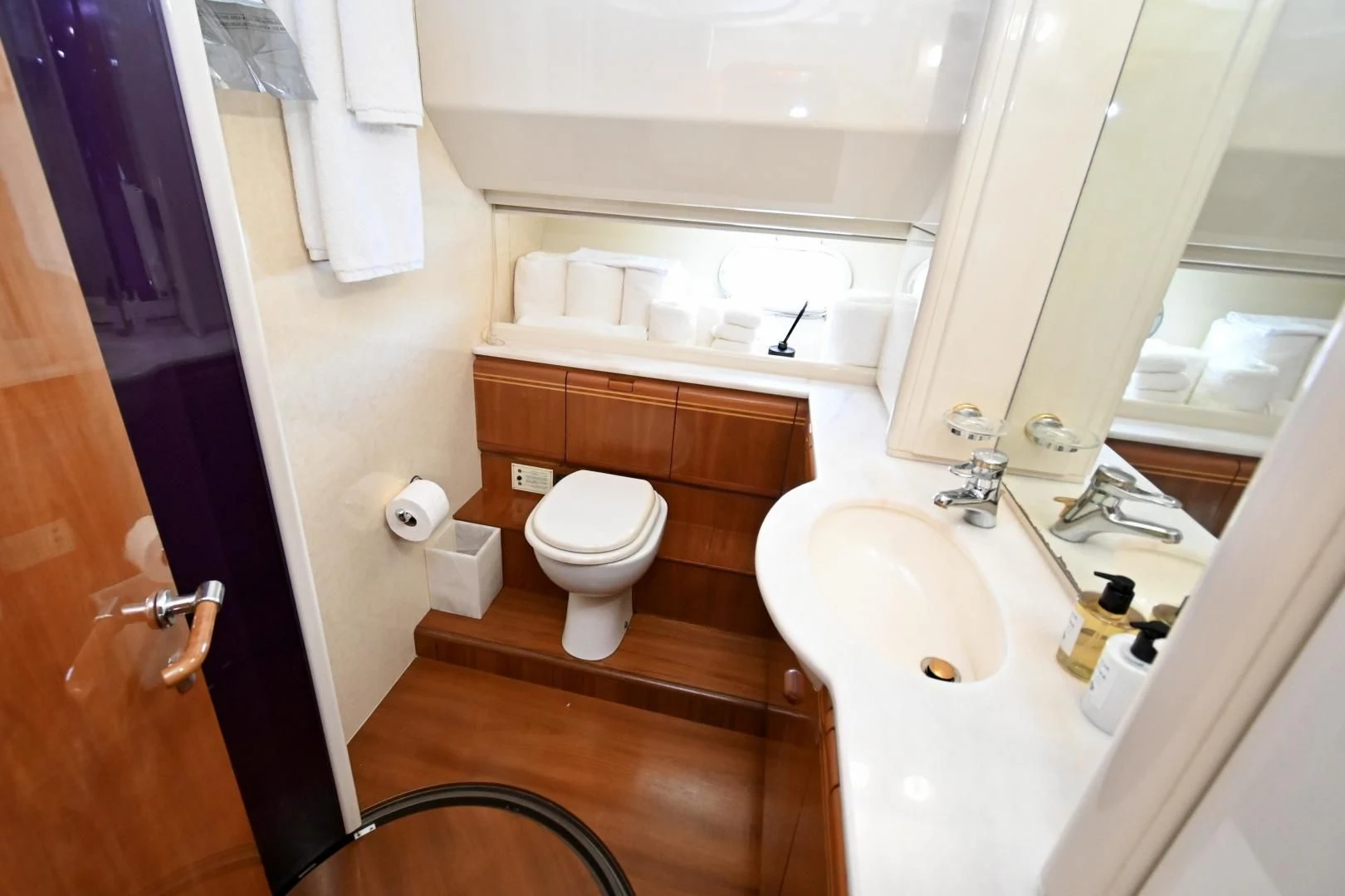 a bathroom with a toilet sink and a mirror aboard RABBIT Yacht for Sale