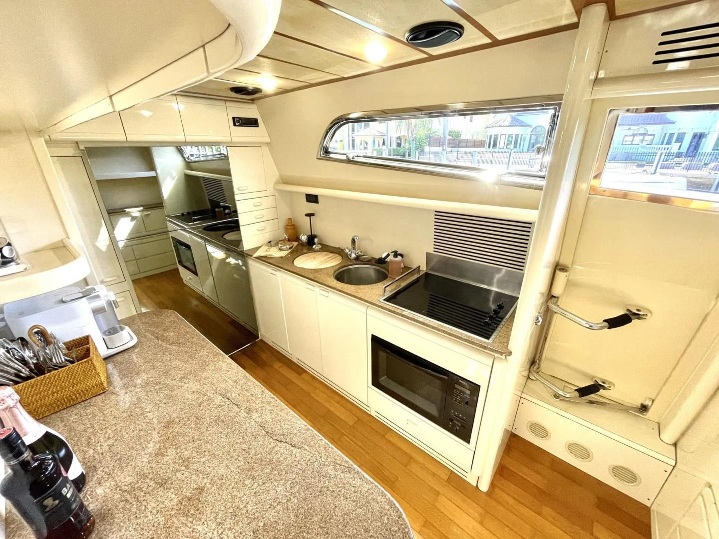 a kitchen with a large window aboard RABBIT Yacht for Sale