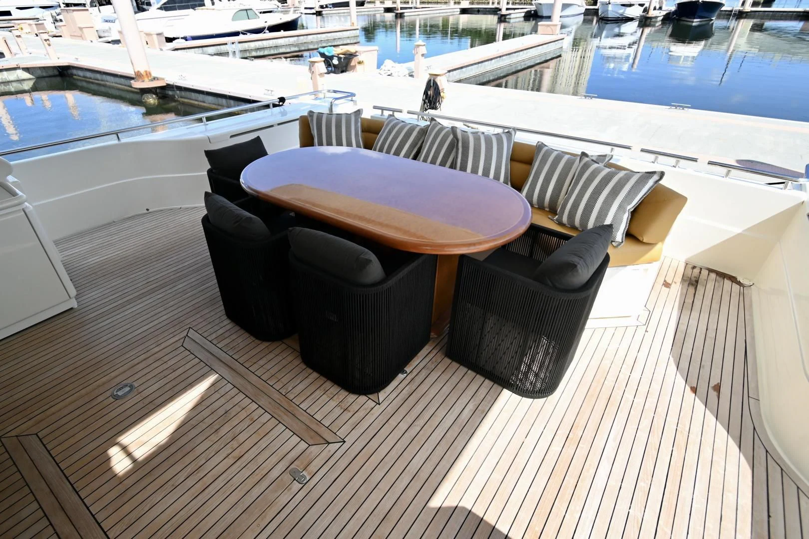 a table and chairs on a deck aboard RABBIT Yacht for Sale