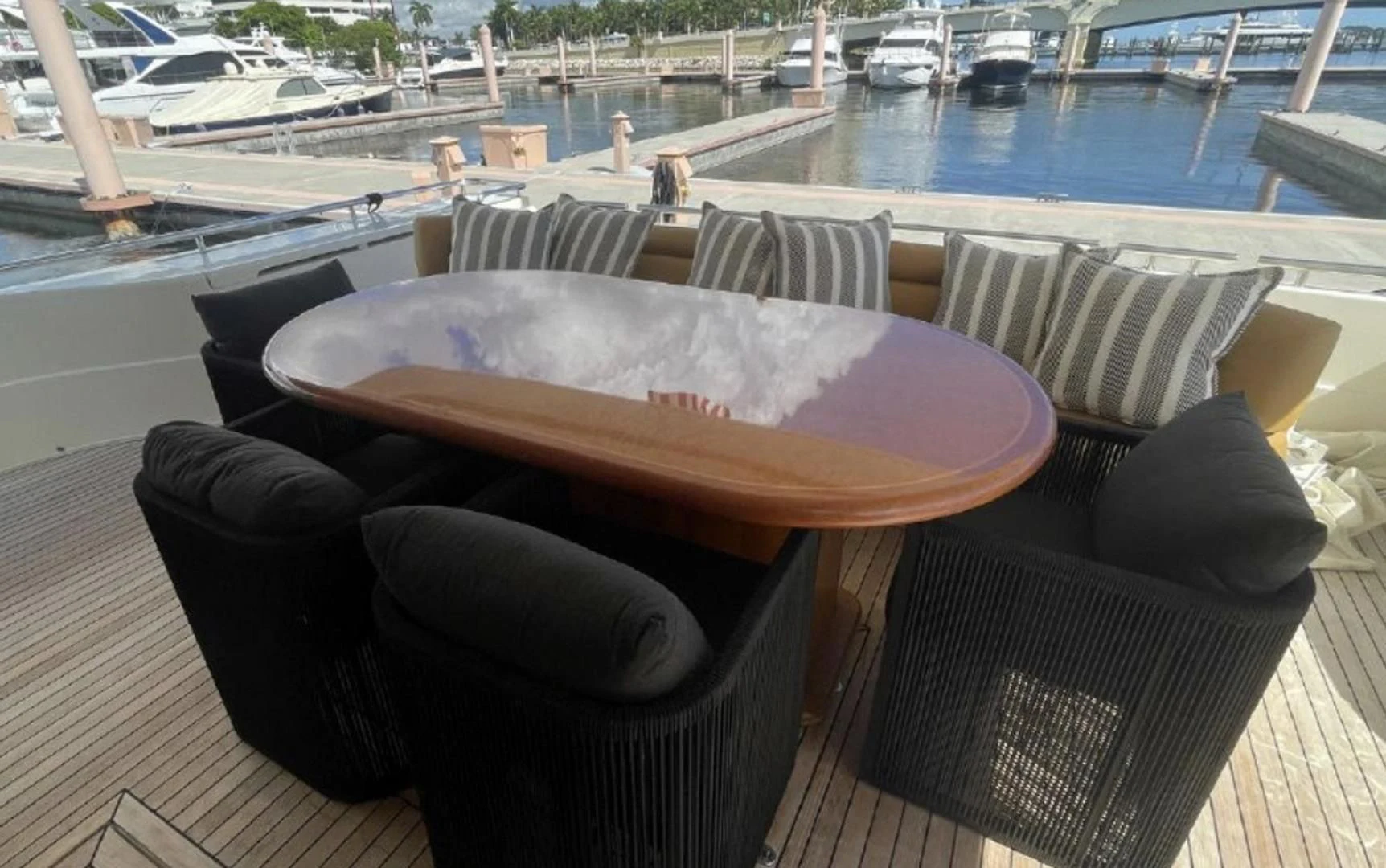 a table and chairs on a deck aboard RABBIT Yacht for Sale