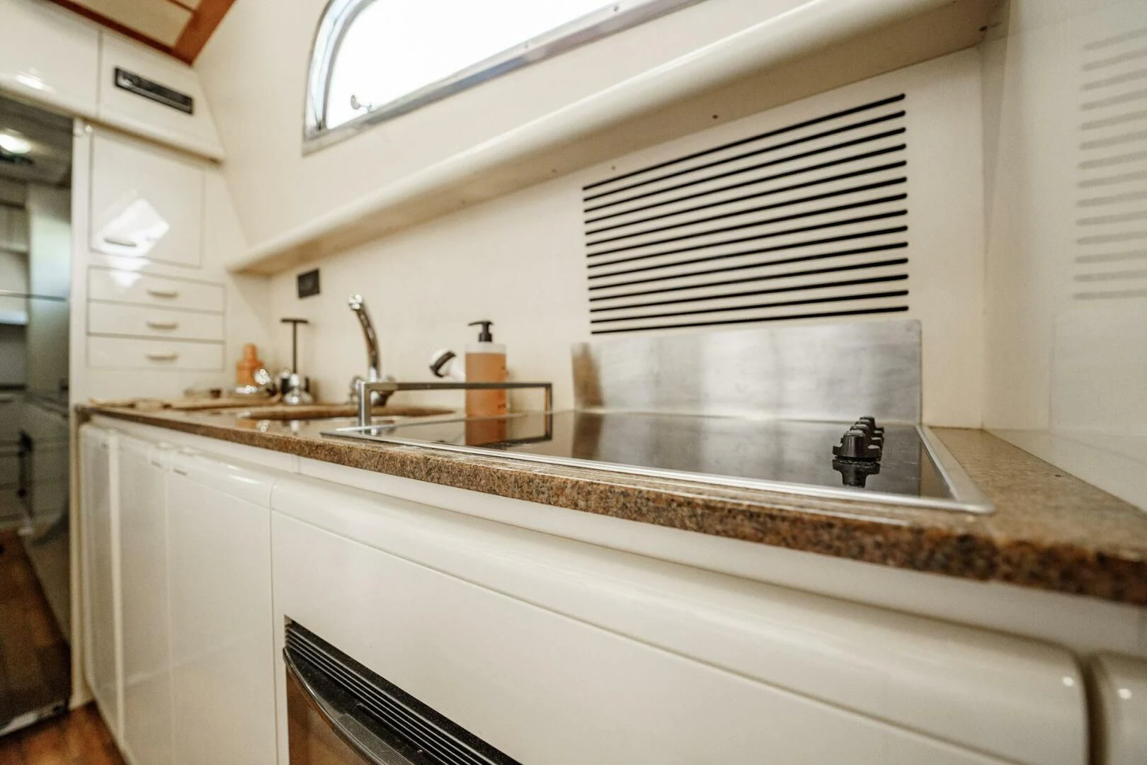 a kitchen with a large sink aboard RABBIT Yacht for Sale