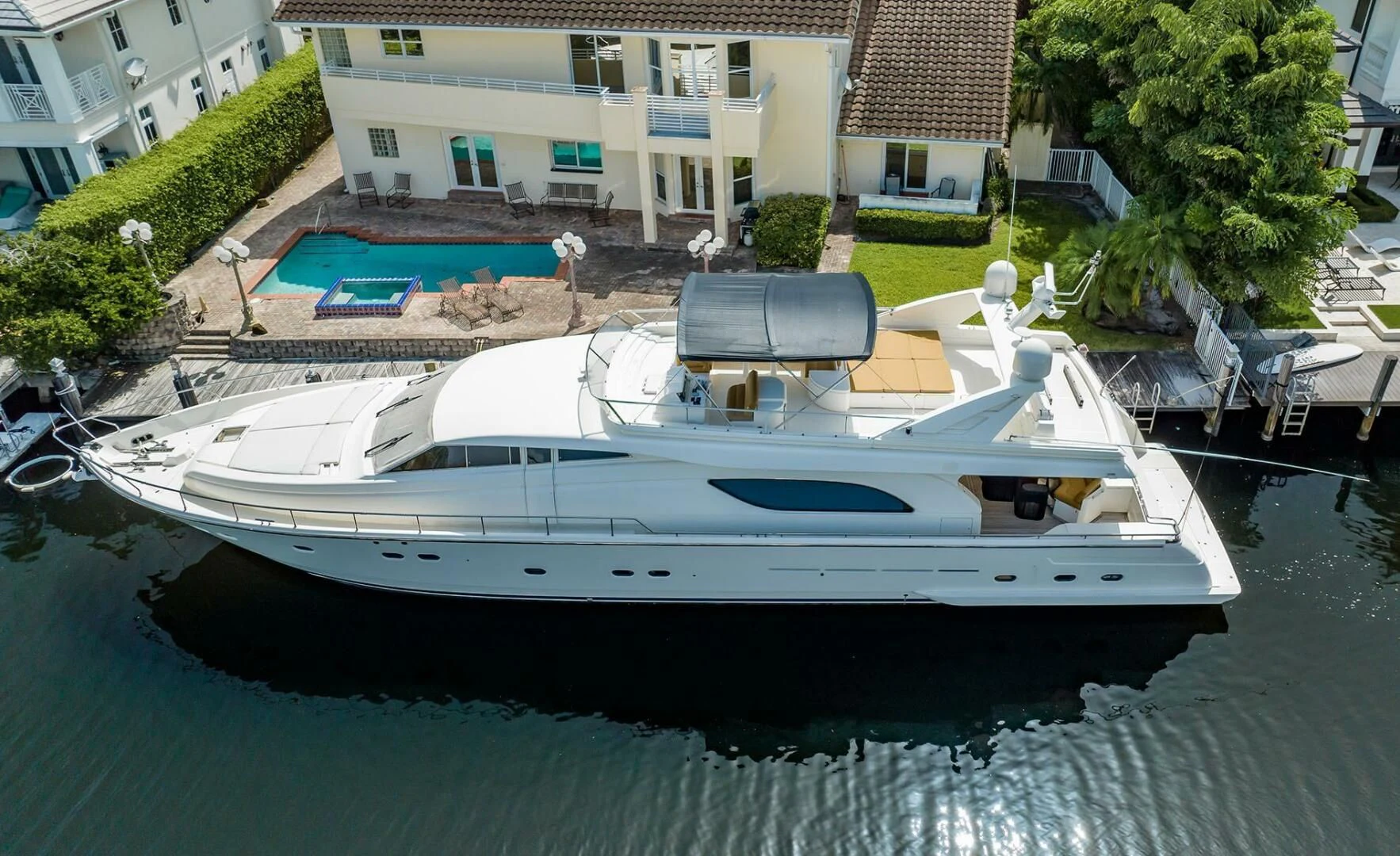 a boat parked on the side of a river aboard RABBIT Yacht for Sale