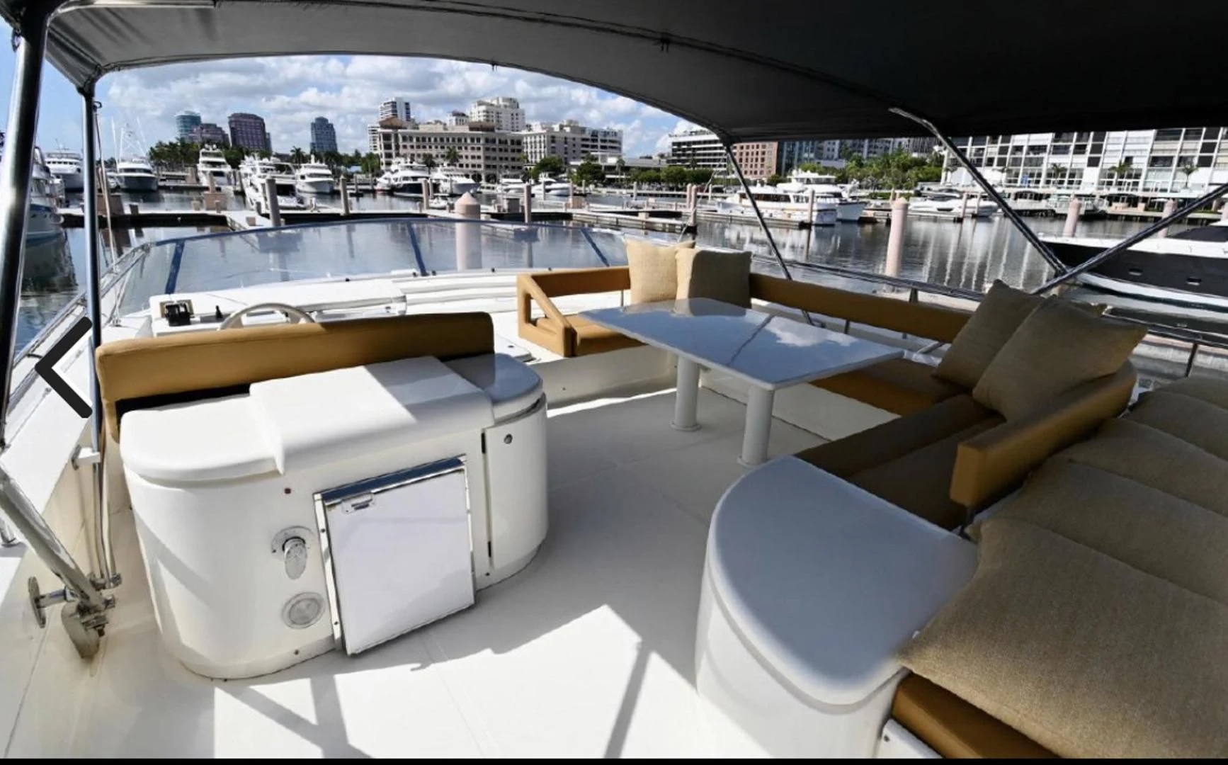 a room with a view of a city and a large pool aboard RABBIT Yacht for Sale
