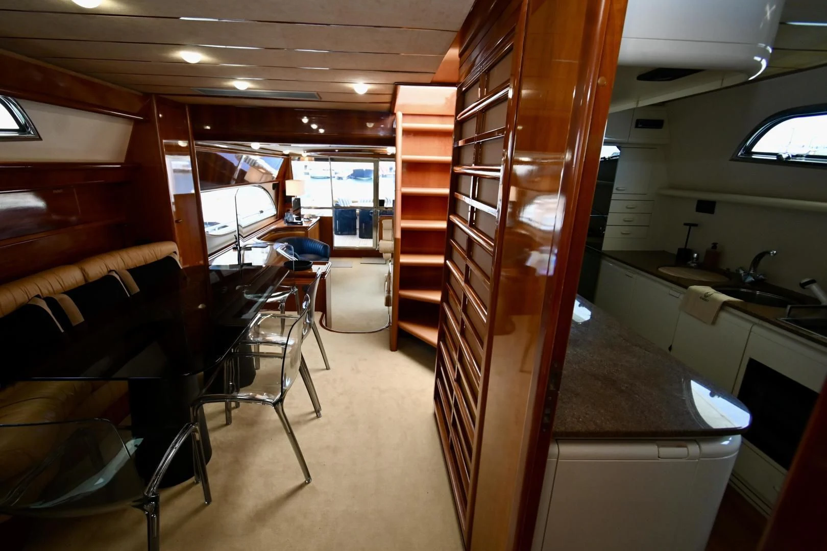 a room with a wood door and a desk with chairs and a table aboard RABBIT Yacht for Sale