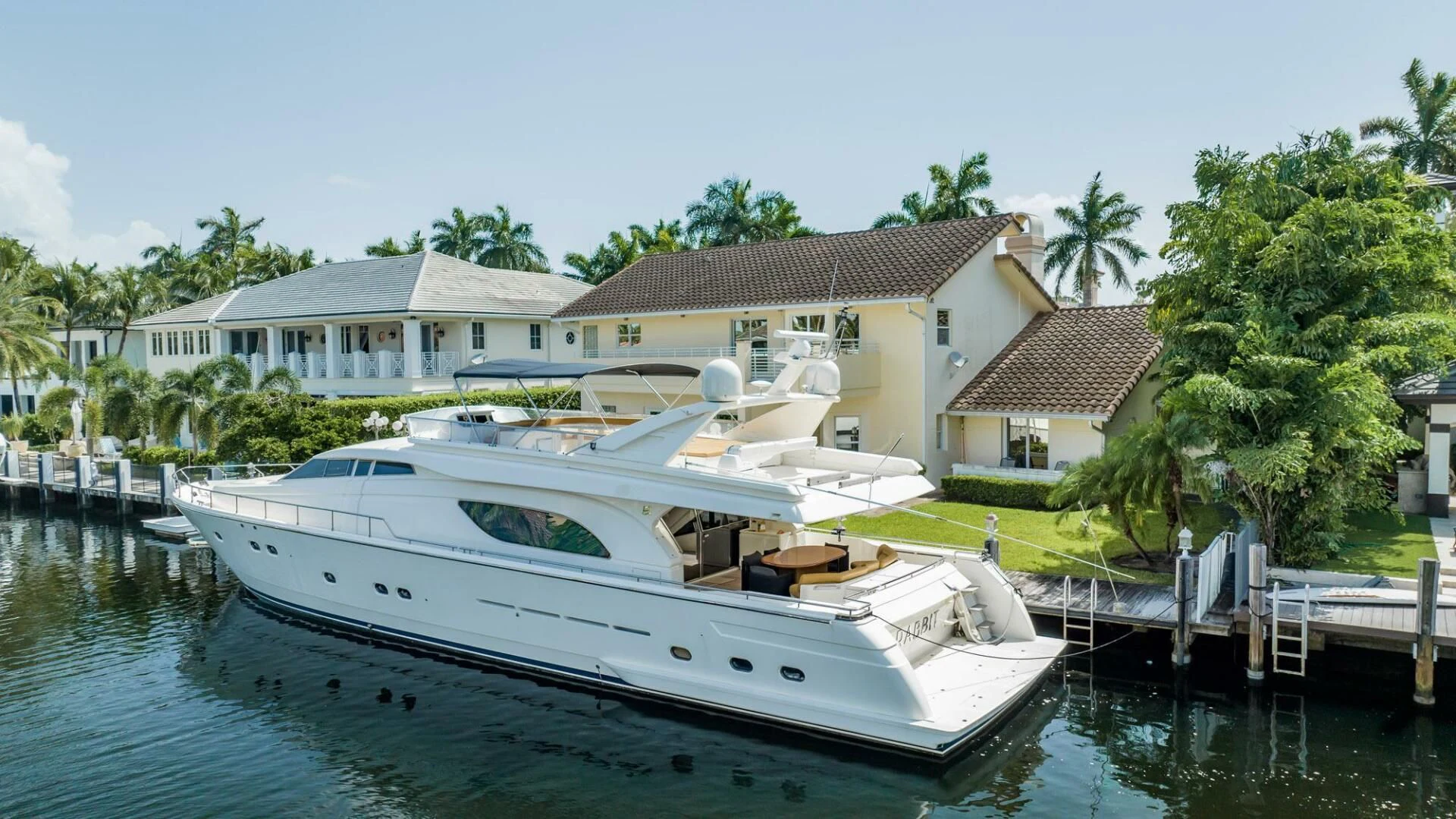 a boat docked at a pier aboard RABBIT Yacht for Sale