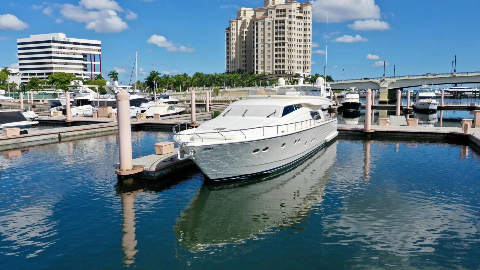 a marina with boats and buildings aboard RABBIT Yacht for Sale