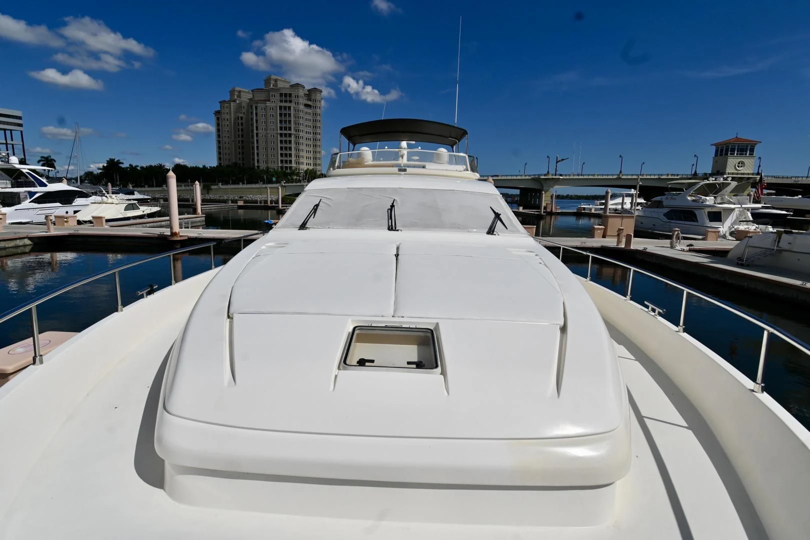 a white yacht in a harbor aboard RABBIT Yacht for Sale