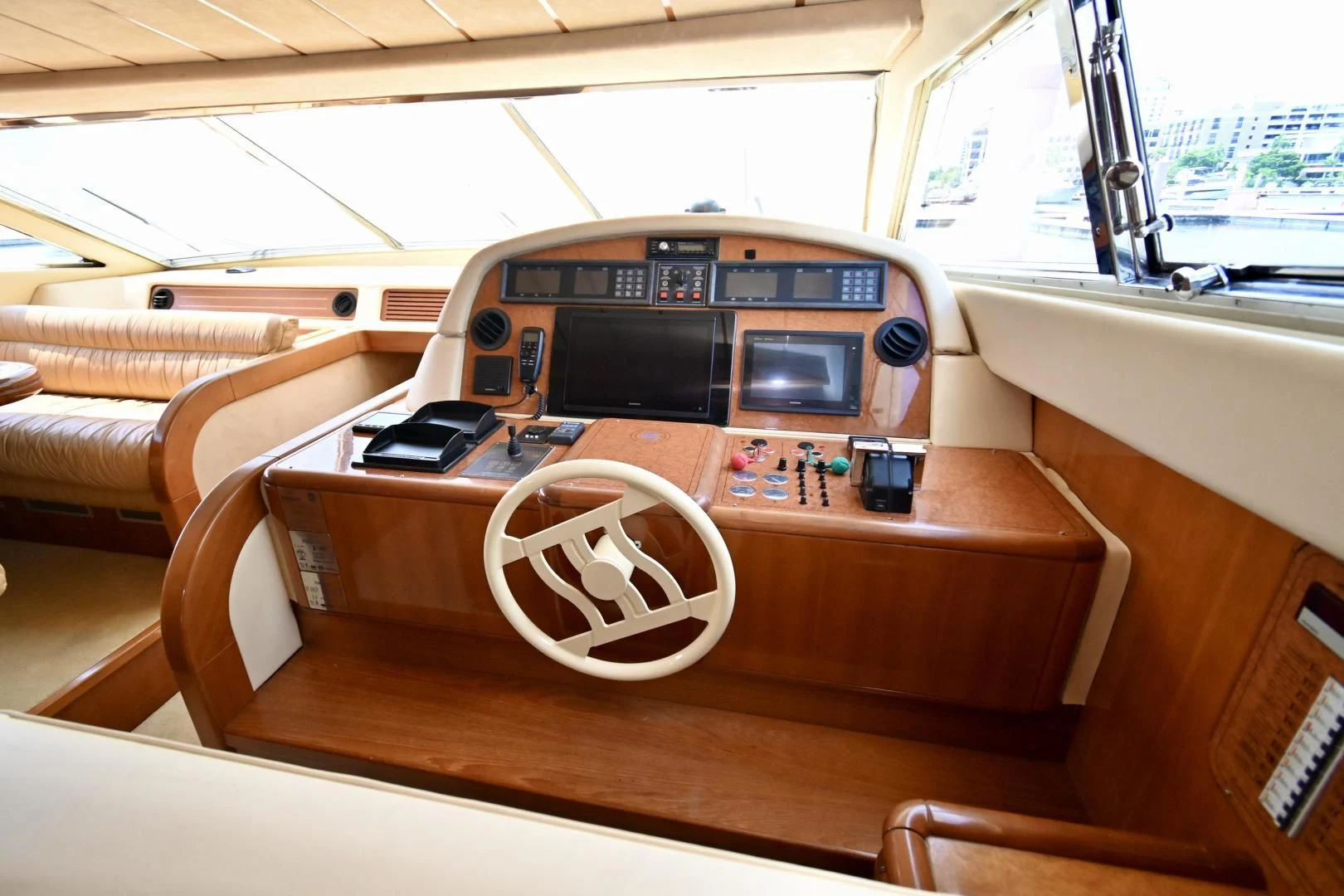 a wooden table with a steering wheel and a white circle on it aboard RABBIT Yacht for Sale