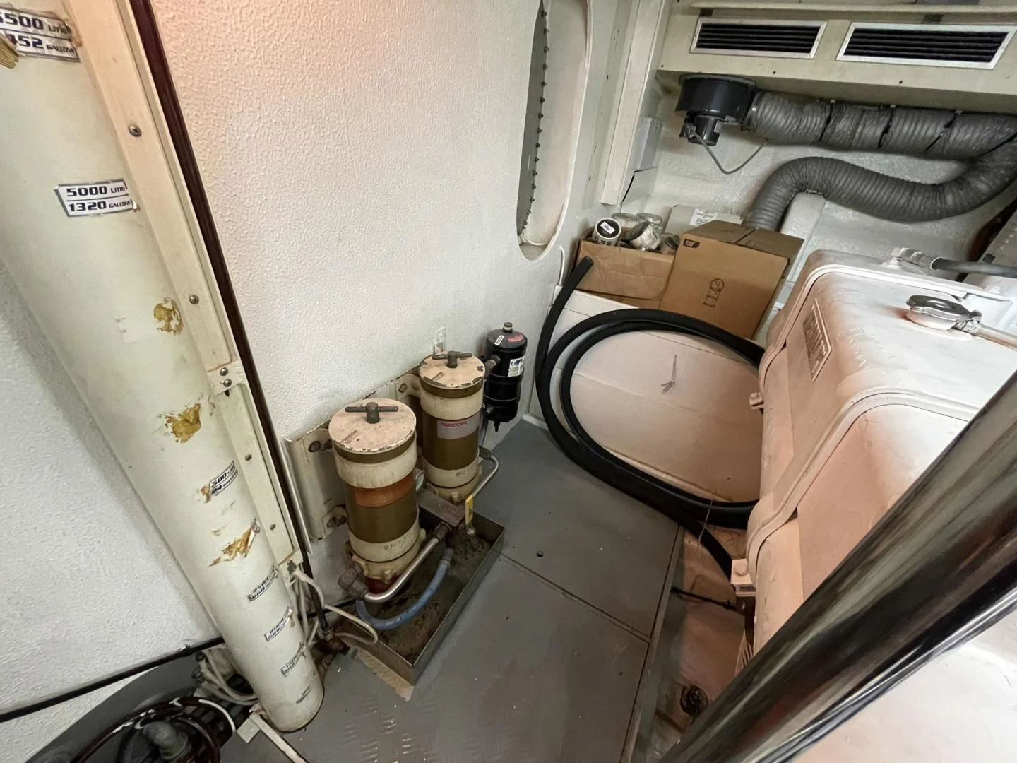 a room with a large box and a small box in the corner aboard RABBIT Yacht for Sale