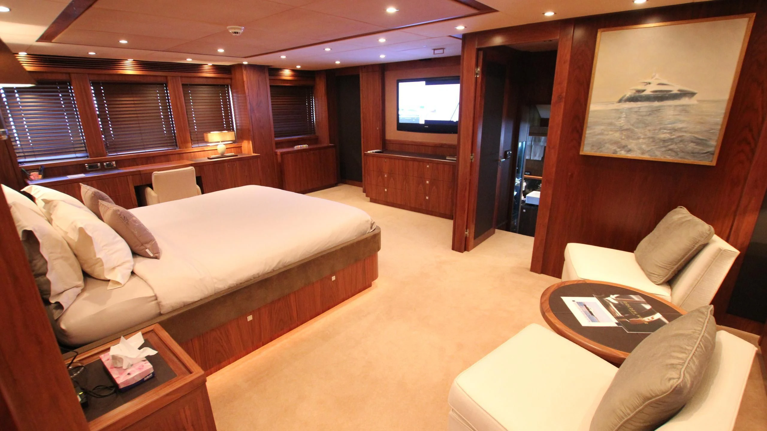a room with a bed and a tv aboard THE DEVOCEAN Yacht for Sale
