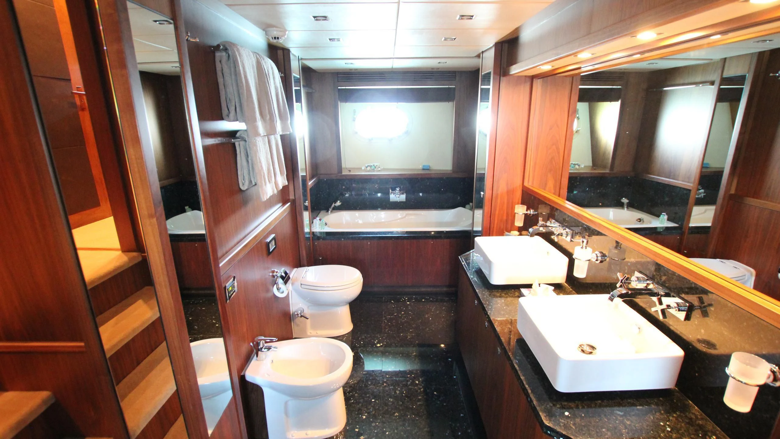 a bathroom with a sink toilet and a bathtub aboard THE DEVOCEAN Yacht for Sale