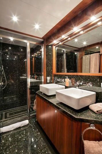 a bathroom with a sink and a shower aboard THE DEVOCEAN Yacht for Sale