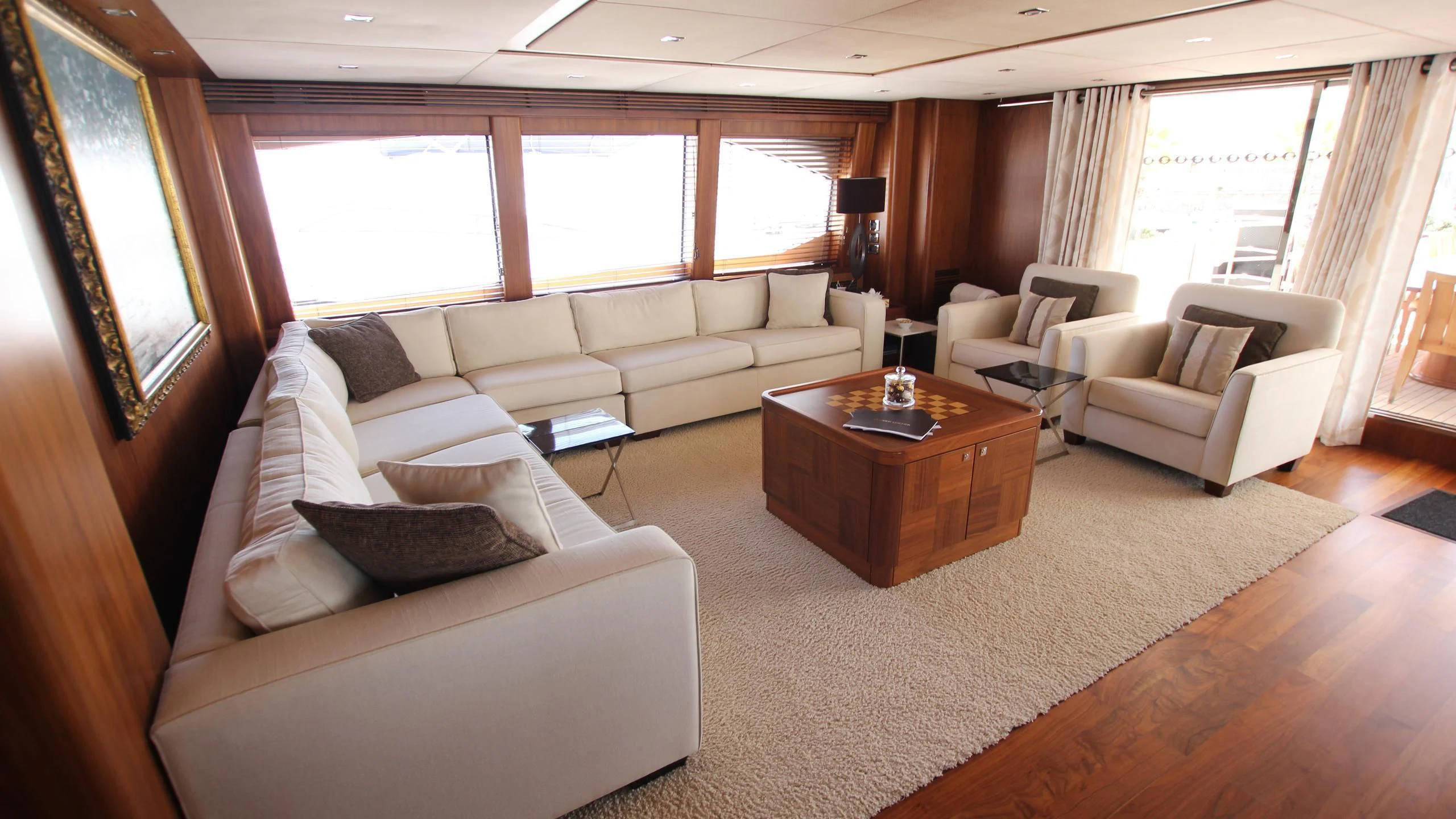a living room with a couch and a coffee table aboard THE DEVOCEAN Yacht for Sale