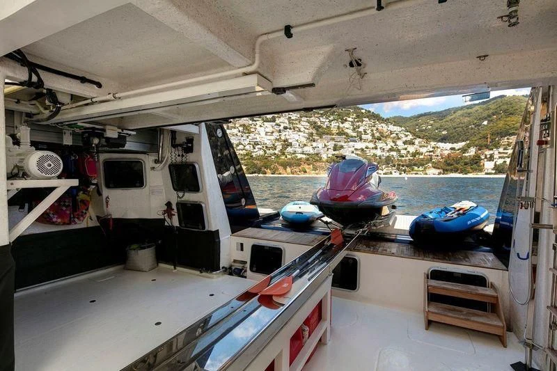 a boat with a large amount of fishing nets on the deck aboard THE DEVOCEAN Yacht for Sale