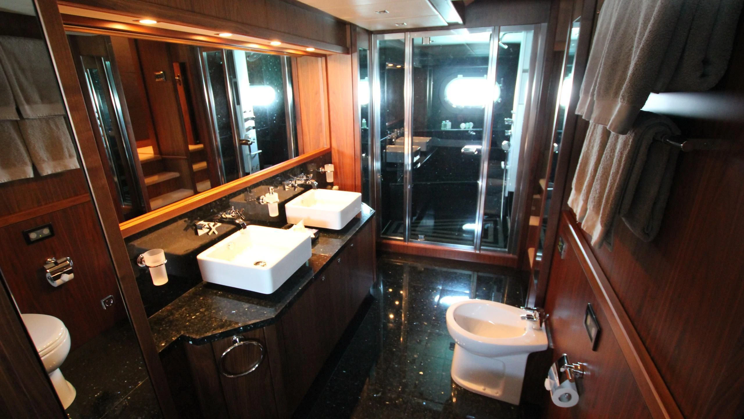 a bathroom with a large mirror aboard THE DEVOCEAN Yacht for Sale
